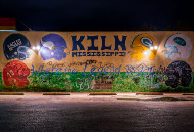A mural painted on the wall of a gas station in Kiln Mississippi with all the helmets Brett Favre wore.