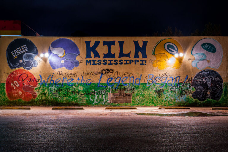 Brett Favre Mural in Kiln, Mississippi 1 A mural painted on the wall of a gas station in Kiln Mississippi with all the helmets Brett Favre wore.