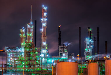 This nighttime industrial scene is from Baton Rouge, Louisiana, home to one of the largest oil refining and petrochemical hubs in the United States. The brightly lit towers and distillation columns belong to facilities along the Mississippi River Industrial Corridor, where refineries like ExxonMobil Baton Rouge operate around the clock. Steam and flares mark the ongoing refining processes that produce gasoline, diesel, and chemical feedstocks central to the region’s economy. The image captures the city’s long-standing connection to the energy and manufacturing industries.
