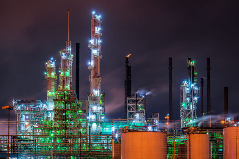 Exxon Mobile Baton Rouge Refinery 2 This nighttime industrial scene is from Baton Rouge, Louisiana, home to one of the largest oil refining and petrochemical hubs in the United States. The brightly lit towers and distillation columns belong to facilities along the Mississippi River Industrial Corridor, where refineries like ExxonMobil Baton Rouge operate around the clock. Steam and flares mark the ongoing refining processes that produce gasoline, diesel, and chemical feedstocks central to the region’s economy. The image captures the city’s long-standing connection to the energy and manufacturing industries.