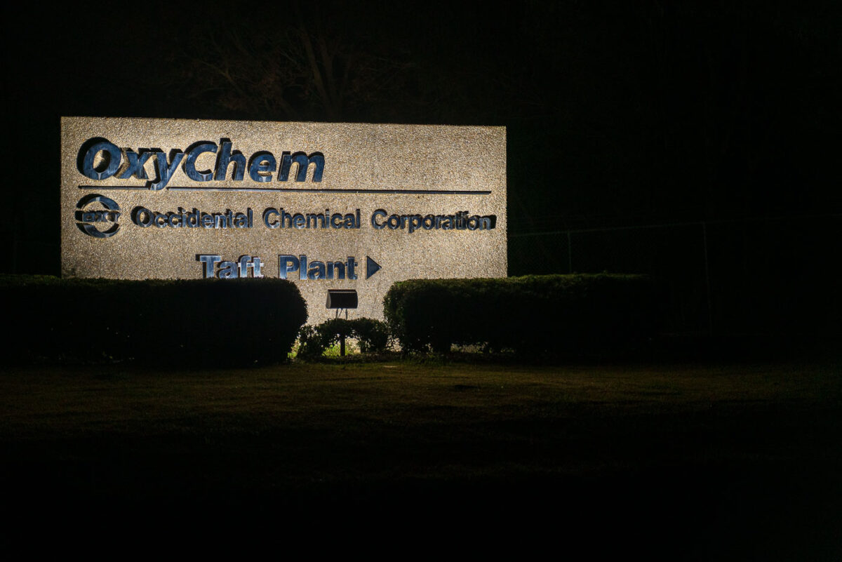 The Taft Plant, operated by Occidental Chemical Corporation (OxyChem), sits along Louisiana’s heavily industrialized river corridor between Baton Rouge and New Orleans. Like many facilities in the region, the plant plays a role in the state’s vast petrochemical network, producing essential compounds for plastics, coatings, and other materials that fuel modern life. At night, its illuminated sign cuts through the darkness, a quiet marker of the sprawling industry that has shaped both the economy and the environmental debates of the Mississippi River corridor.
