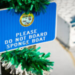 Sign on a sponge boat in Tarpon Springs, Florida.Please do not board sponge boat