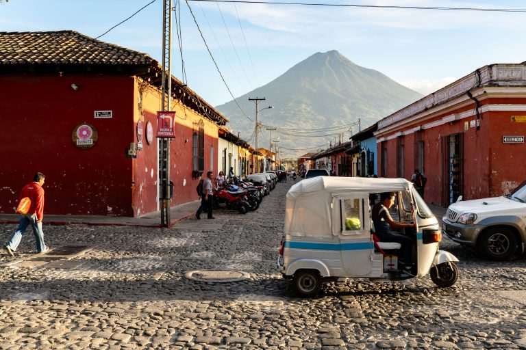 Tuk-Tuk on Cobblestone Street, Antigua, Guatemala 2 Colorful colonial street in Granada, Nicaragua with tuk-tuk and Mombacho volcano in background.