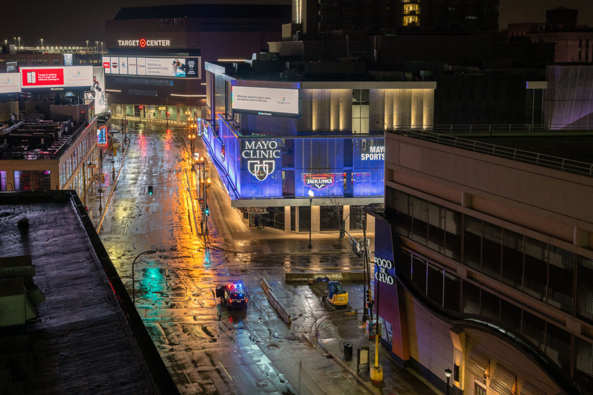 A police officer at Hennepin Avenue after Stay at Home order.