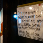 A pandemic closure sign on a barber shop in Minneapolis
