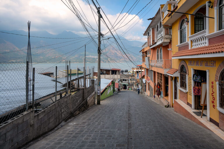 San Pedro and Lake Atitlan Guatemala 3 March 3, 2020 - San Pedro, Guatemala -- A woman walks in front of a jewelry and art gallery in San Pedro.