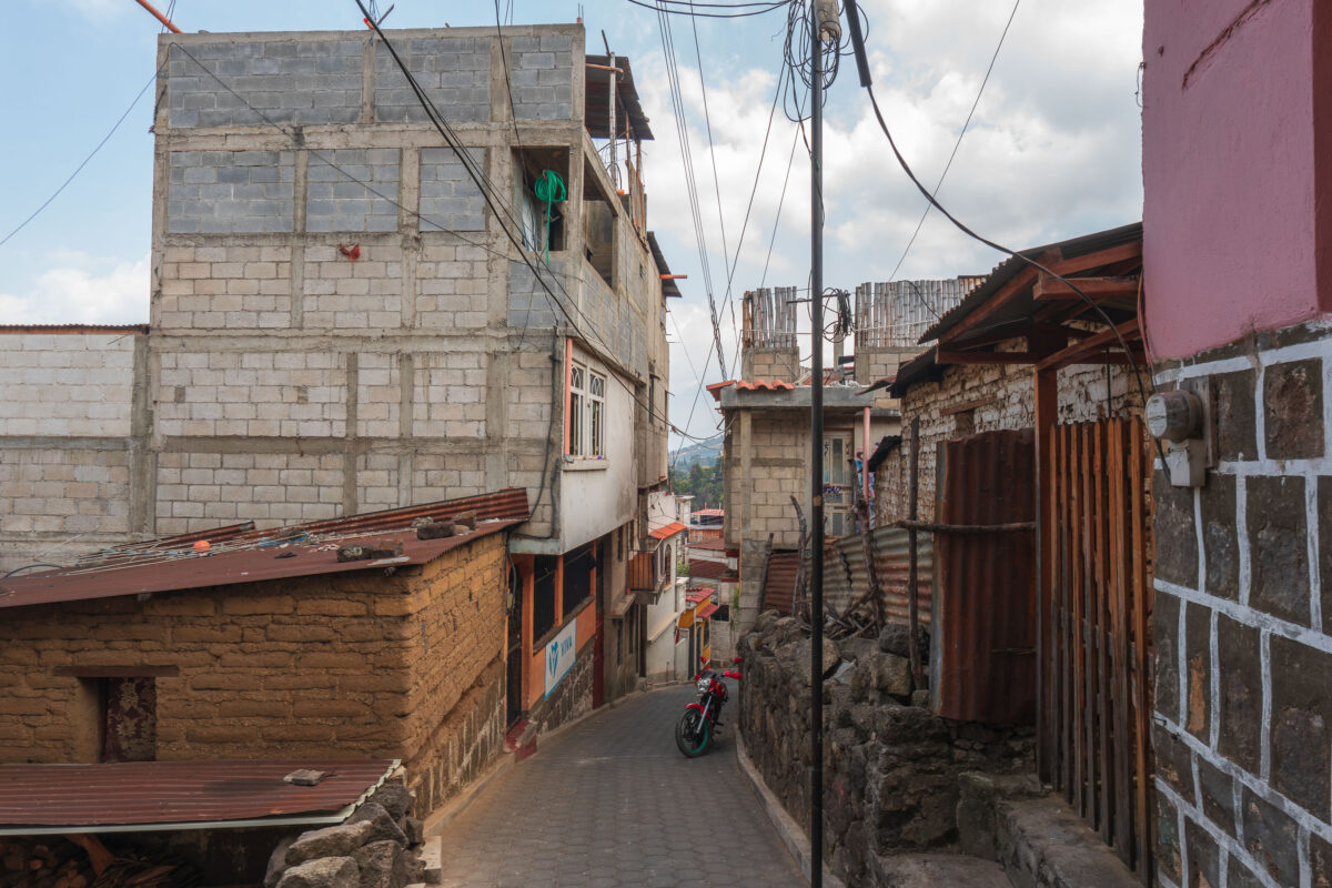 Red Motorcycle on Cobblestone Street in San Pedro, Guatemala