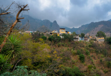 Santa Cruz La Laguna is a traditional Mayan village located on the steep mountainside of the lake, roughly 325 vertical feet above the lake's surface (population: approximately 3,100). The village has the unique characteristic of being accessible only by boat or footpath. A single, winding road connects the dock to the village. There is a very rough road connecting Santa Cruz to Sololá which is used to transport heavy goods, concrete blocks, furniture, and a few vehicles.

The village has no roads, telephone system, or commercial center, although a common gathering place in the village is the sports court, used for basketball and soccer by the children of the village. Electricity is intermittent and expensive, and is therefore not installed in many households.