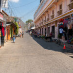 Tourists walk down a street in Panajachel, Guatemala.