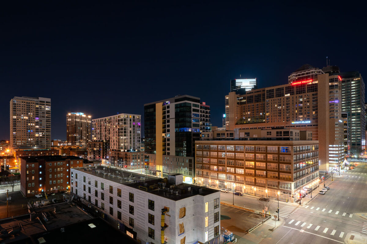 Downtown Minneapolis with Hyatt Place and Centre Village signs.