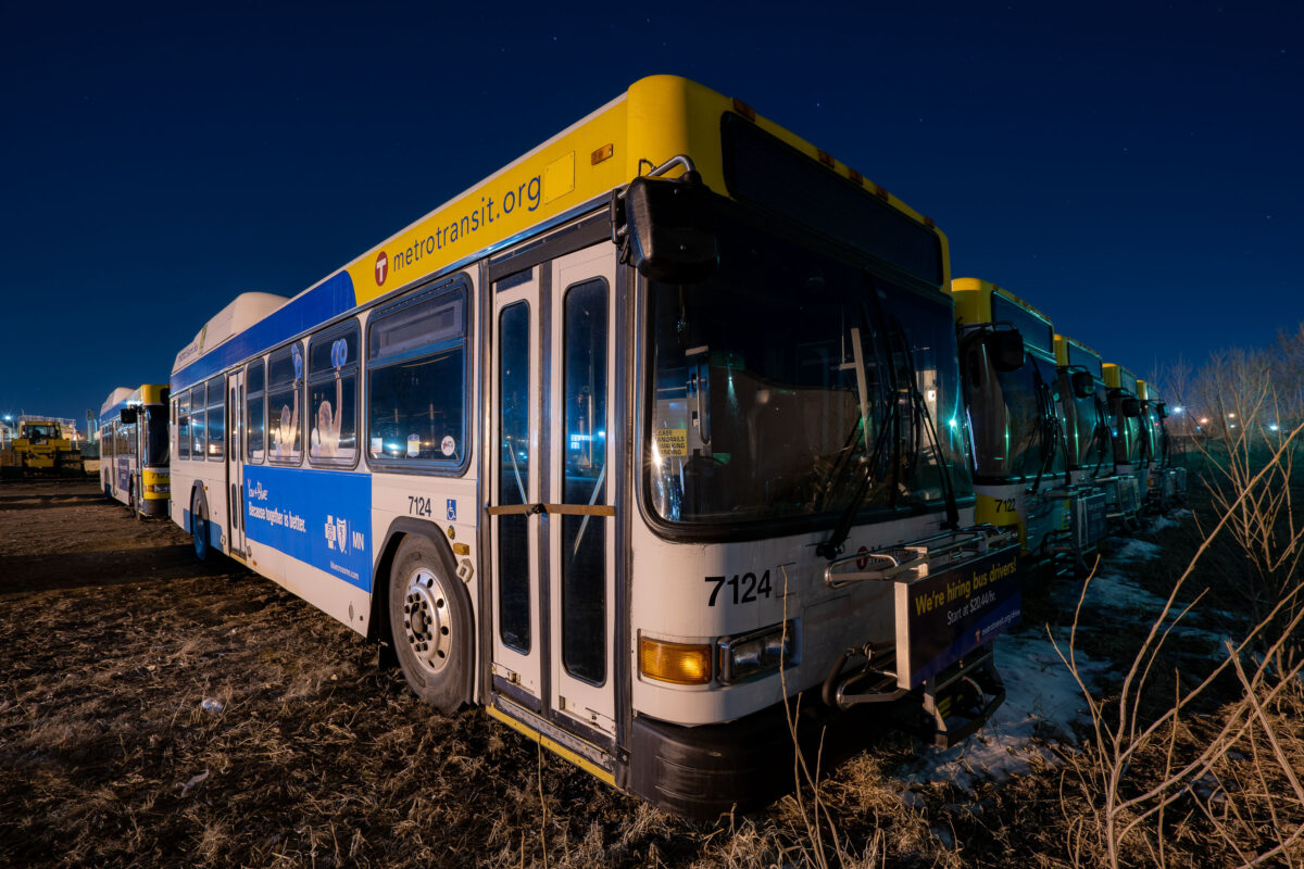 Metro Transit buses in a storage lot in North Minneapolis at night.