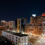 Downtown Minneapolis with Hyatt Place and Centre Village signs.