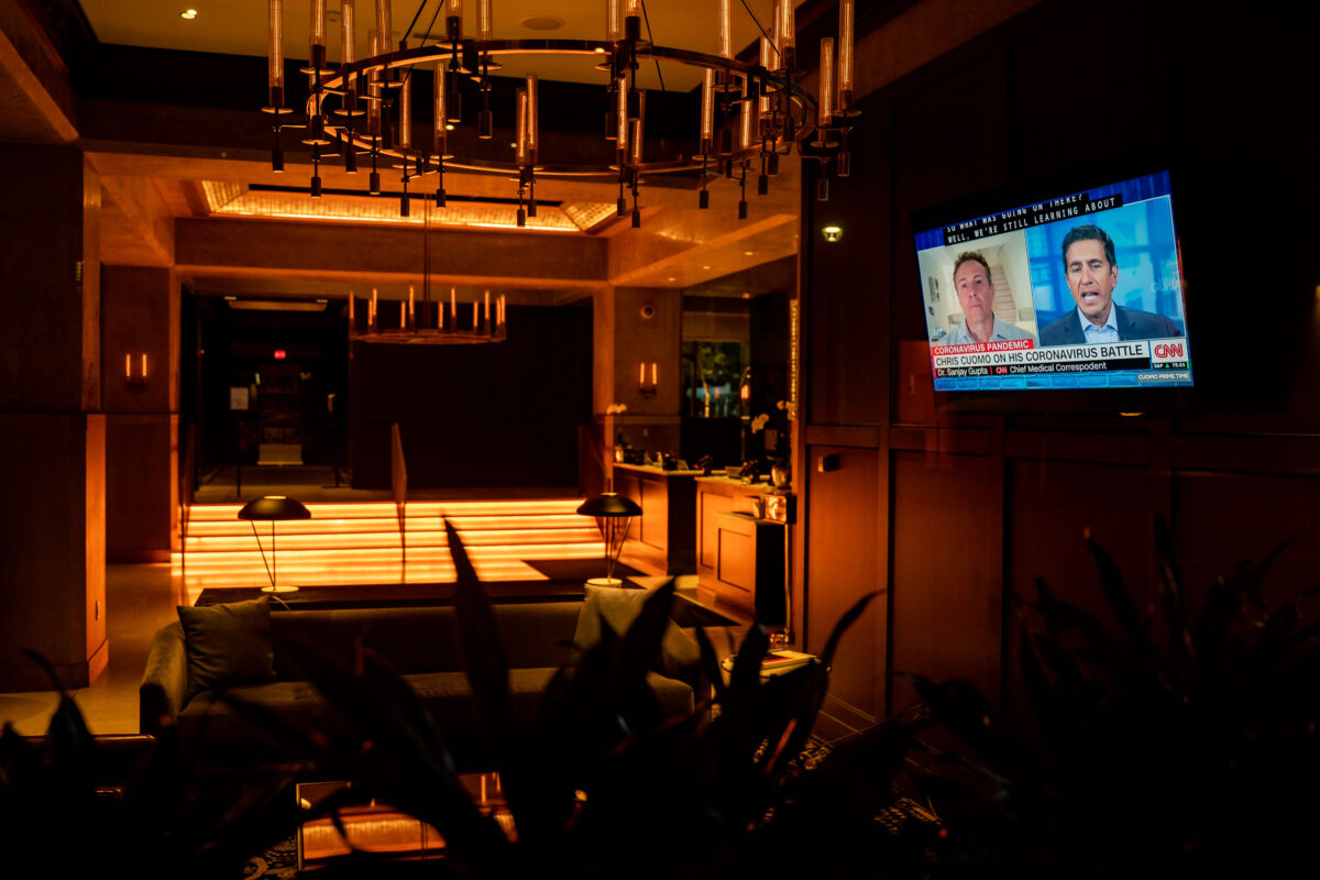 TV airing a CNN coronavirus report in the Marquette Hotel lobby, downtown Minneapolis.