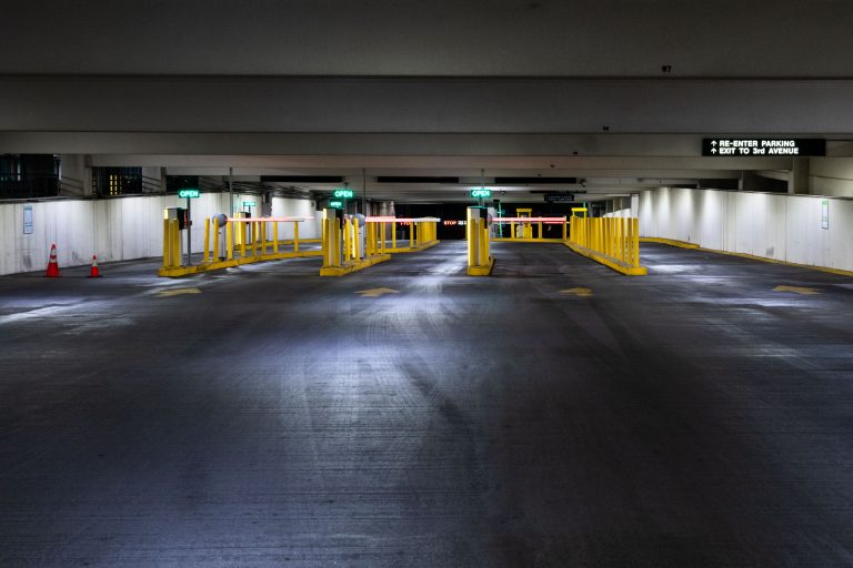 Exit Lanes at Ramp C Parking Garage in Downtown Minneapolis 1 Yellow bollards and safety barriers line an empty level of Ramp C parking garage in downtown Minneapolis.