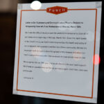 A sign on the door of Punch Restaurant in Minneapolis.
