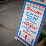 Social distancing signage outside a Walgreens store in Minneapolis during COVID-19 closures.