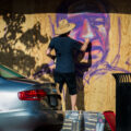 A street artist painting boards on Hennepin Ave on May 31, 2020 after days of protests following the death of George Floyd on May 25th, 2020.