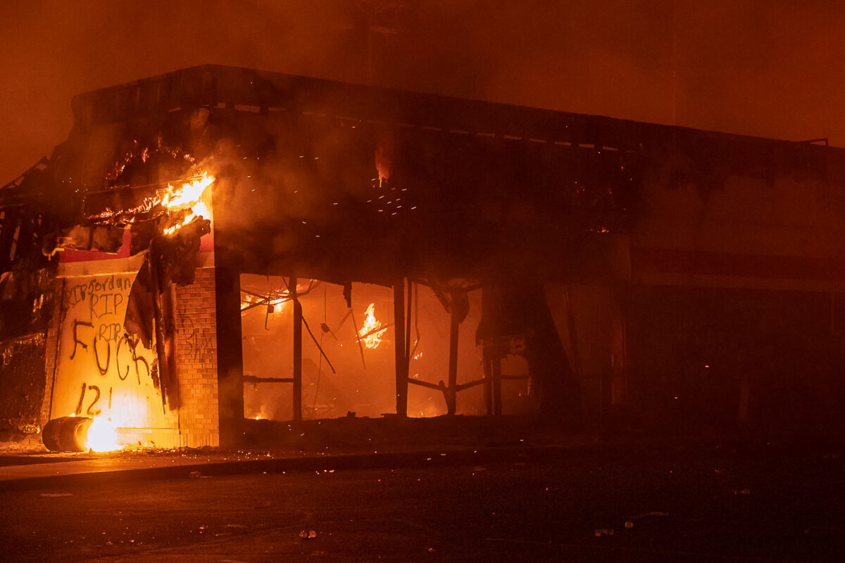 The AutoZone store across from the Minneapolis Police 3rd Precinct burning on the 2nd day of protests in Minneapolis following the death of George Floyd.  The AutoZone was the first building to be lit on fire during the George Floyd protests.