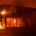 The AutoZone store across from the Minneapolis Police 3rd Precinct burning on the 2nd day of protests in Minneapolis following the death of George Floyd.  The AutoZone was the first building to be lit on fire during the George Floyd protests.