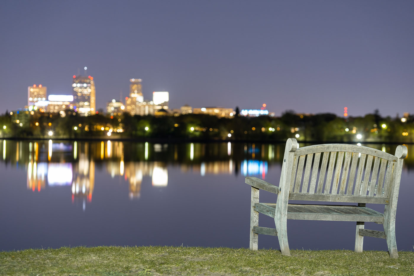 Bench on Bde Maka Ska with skyline across lake
