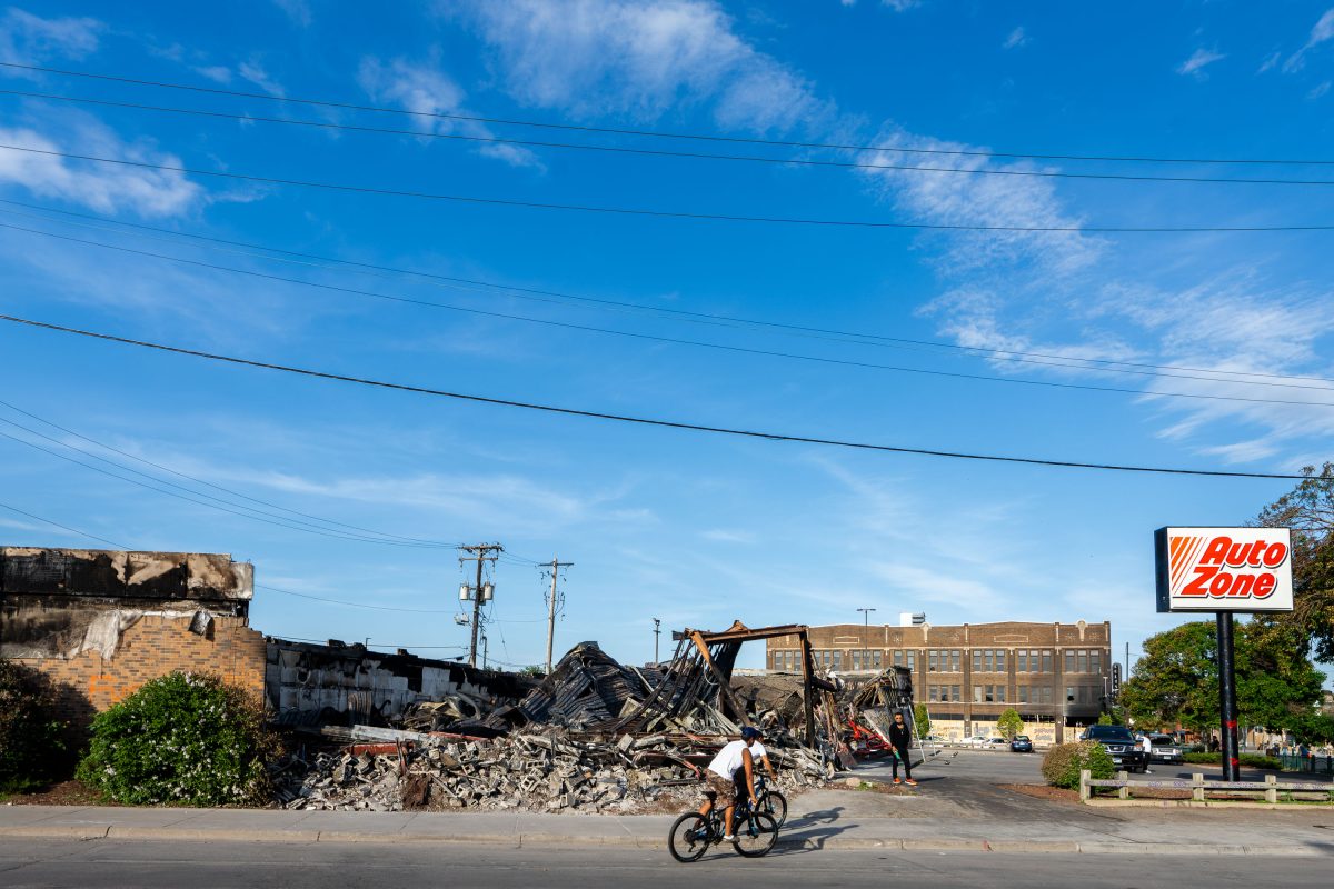 Bikers outside the burned AutoZone in Minneapolis