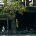 People walk by the burned out Foot Locker store on May 31, 2020 after it was burned in fires following the death of George Floyd.