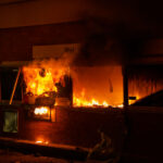 A Wells Fargo Bank located across the street from the Minneapolis police fifth precinct burns.