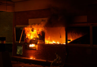 A Wells Fargo Bank located across the street from the Minneapolis police fifth precinct burns.