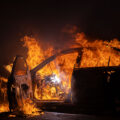 A car burns at Wells Fargo bank on E 31st St, across from the Minneapolis Police 5th Precinct. Protesters had gathered following a march through South Minneapolis on the 4th day of protests in Minneapolis following the death of George Floyd.