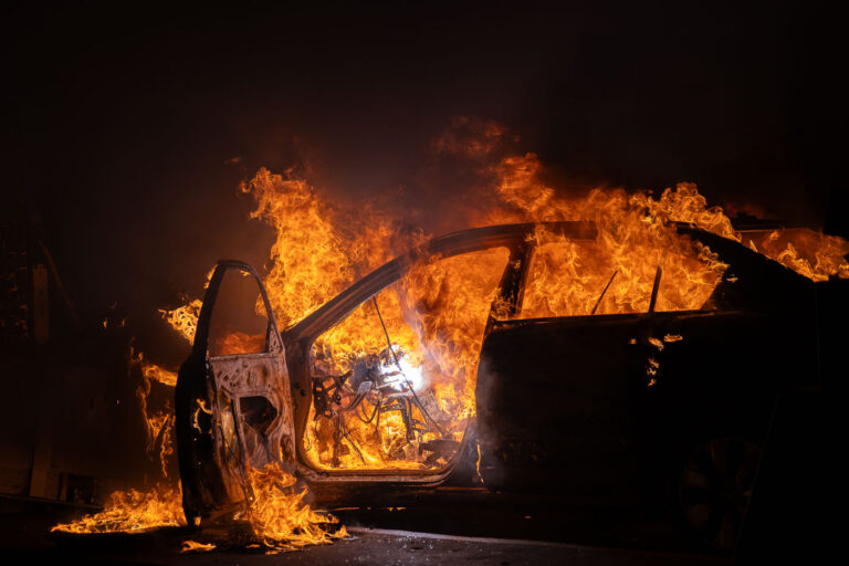 Car on fire at Wells Fargo on E 31st St in Minneapolis 2 A car burns at Wells Fargo bank on E 31st St, across from the Minneapolis Police 5th Precinct. Protesters had gathered following a march through South Minneapolis on the 4th day of protests in Minneapolis following the death of George Floyd.