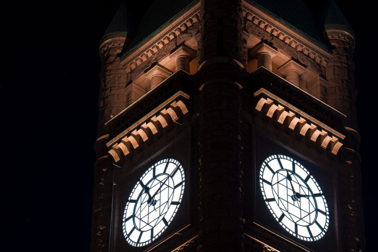 Minneapolis City Hall Clock Tower At Night 1 The clock tower of Minneapolis City Hall glows at night, its illuminated faces visible across downtown. The landmark’s Romanesque architecture remains a defining feature of the city’s skyline.