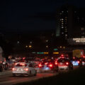 Vehicles follow protesters who had been marching down I-94. Curfew went into place at 8pm.