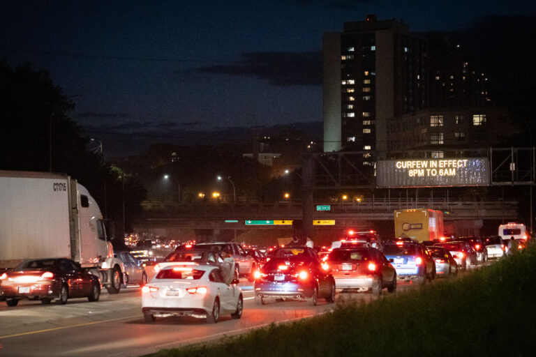 Protesters on I-94 4 Vehicles follow protesters who had been marching down I-94. Curfew went into place at 8pm.