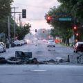 Debris in the road from fires as the sunrises over Pillsbury Ave in South Minneapolis on May 30, 2020 following the 4th day of protests in Minneapolis following the death of George Floyd.