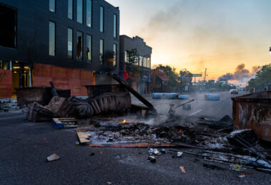 The sun rising on May 30, 2020 in Minneapolis over Lake Street. The street littered with debris from fires after the 4th day of protests in Minneapolis following the death of George Floyd.