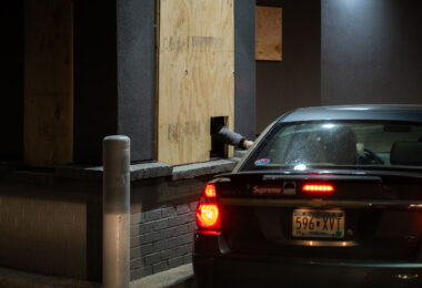 McDonald’s on Hennepin Ave in Uptown Minneapolis still serving through a small hole in a board.