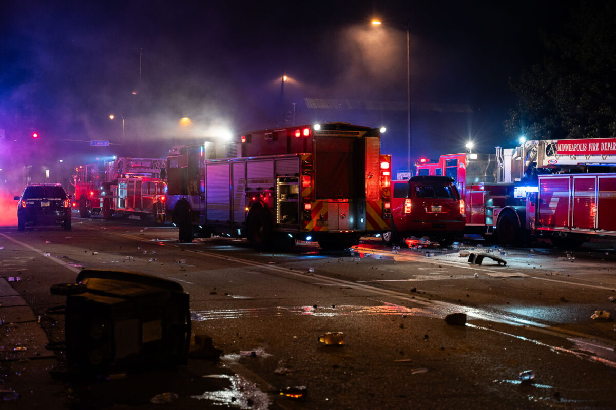 Minneapolis Fire Department works on putting out fires on the corner of East Lake Street and Minnehaha Avenue. The AutoZone on the corner was the first fire lit during the uprising.