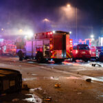 Minneapolis Fire Department works on putting out fires on the corner of East Lake Street and Minnehaha Avenue. The AutoZone on the corner was the first fire lit during the uprising.