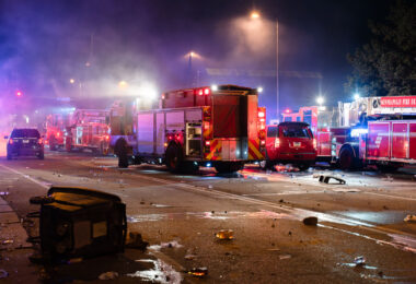 Minneapolis Fire Department works on putting out fires on the corner of East Lake Street and Minnehaha Avenue. The AutoZone on the corner was the first fire lit during the uprising.
