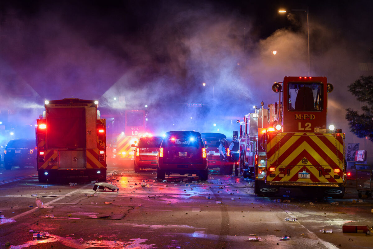 Minneapolis Fire Department works on putting out fires on the corner of East Lake Street and Minnehaha Avenue. The AutoZone on the corner was the first fire lit during the uprising.