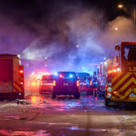 Minneapolis Fire Department works on putting out fires on the corner of East Lake Street and Minnehaha Avenue. The AutoZone on the corner was the first fire lit during the uprising.