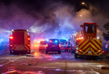 Minneapolis Fire Department works on putting out fires on the corner of East Lake Street and Minnehaha Avenue. The AutoZone on the corner was the first fire lit during the uprising.