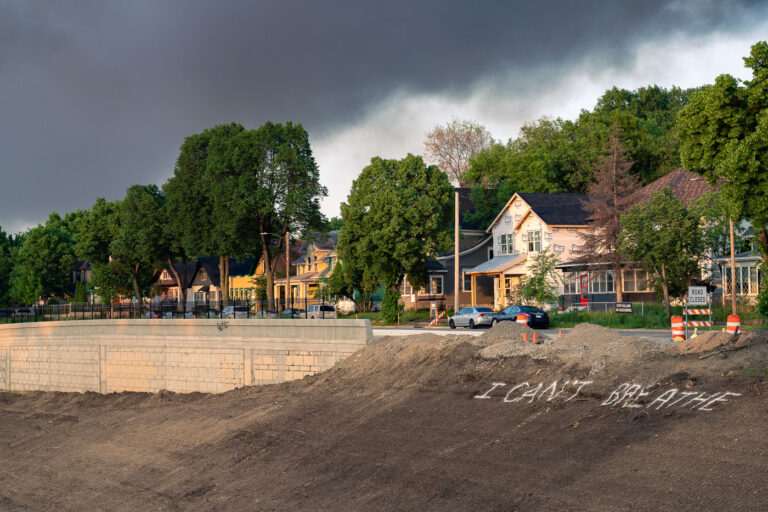 I Can't Breath painted on the highway 4 "I Can't Breath" painted on the dirt of Interstate 35W as the sun rises with heavy smoke still in the air from a night of fires in Minneapolis on May 30, 2020.