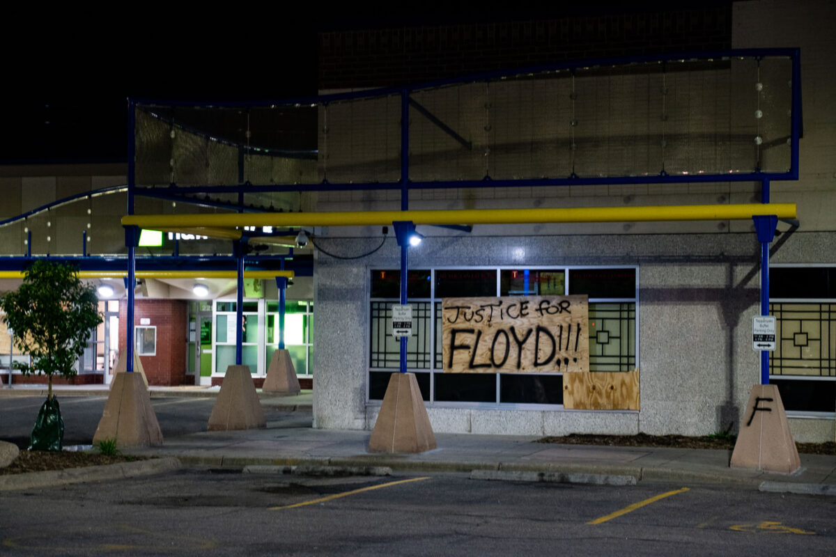 "Justice for Floyd" on a board at a strip mall in Minneapolis on May 29, 2020, the 3rd day of protests in Minneapolis following the death of George Floyd.