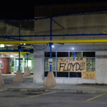 "Justice for Floyd" on a board at a strip mall in Minneapolis on May 29, 2020, the 3rd day of protests in Minneapolis following the death of George Floyd.