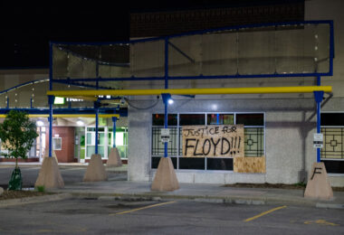 "Justice for Floyd" on a board at a strip mall in Minneapolis on May 29, 2020, the 3rd day of protests in Minneapolis following the death of George Floyd.