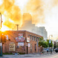 The Minnesota National Guard guards the Minneapolis Fire Department as they work to put out fires following nights of protests in Minneapolis following the death of George Floyd.