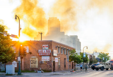The Minnesota National Guard guards the Minneapolis Fire Department as they work to put out fires following nights of protests in Minneapolis following the death of George Floyd.