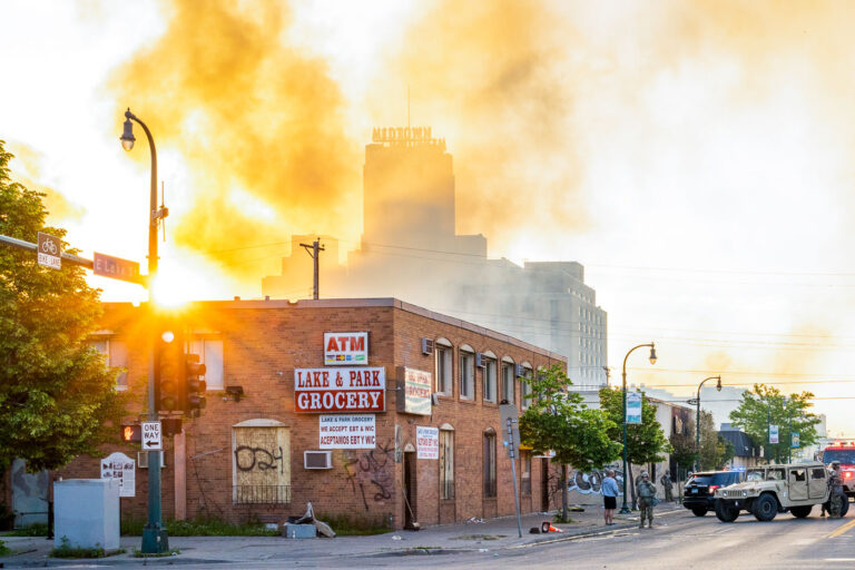 Sun rises over Midtown Exchange 3 The Minnesota National Guard guards the Minneapolis Fire Department as they work to put out fires following nights of protests in Minneapolis following the death of George Floyd.