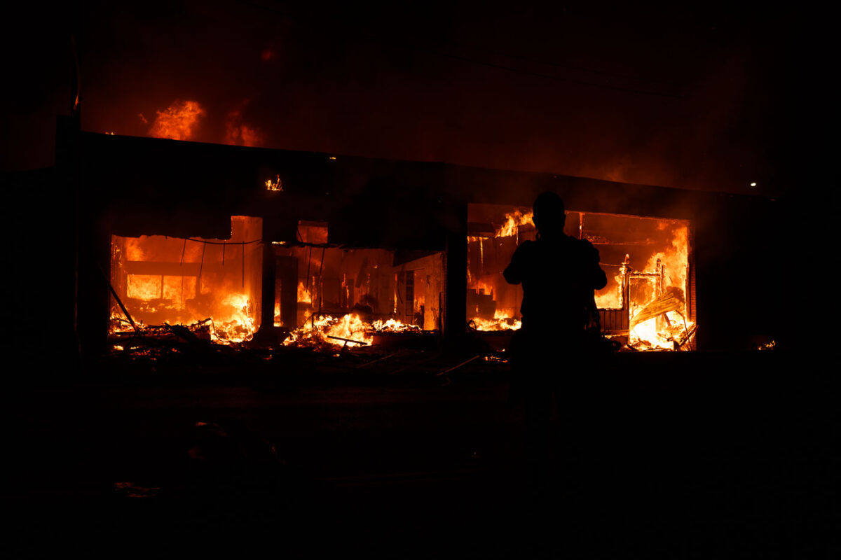 A building on fire on Lake Street in South Minneapolis on the 4th day of protests in Minneapolis following the death of George Floyd.